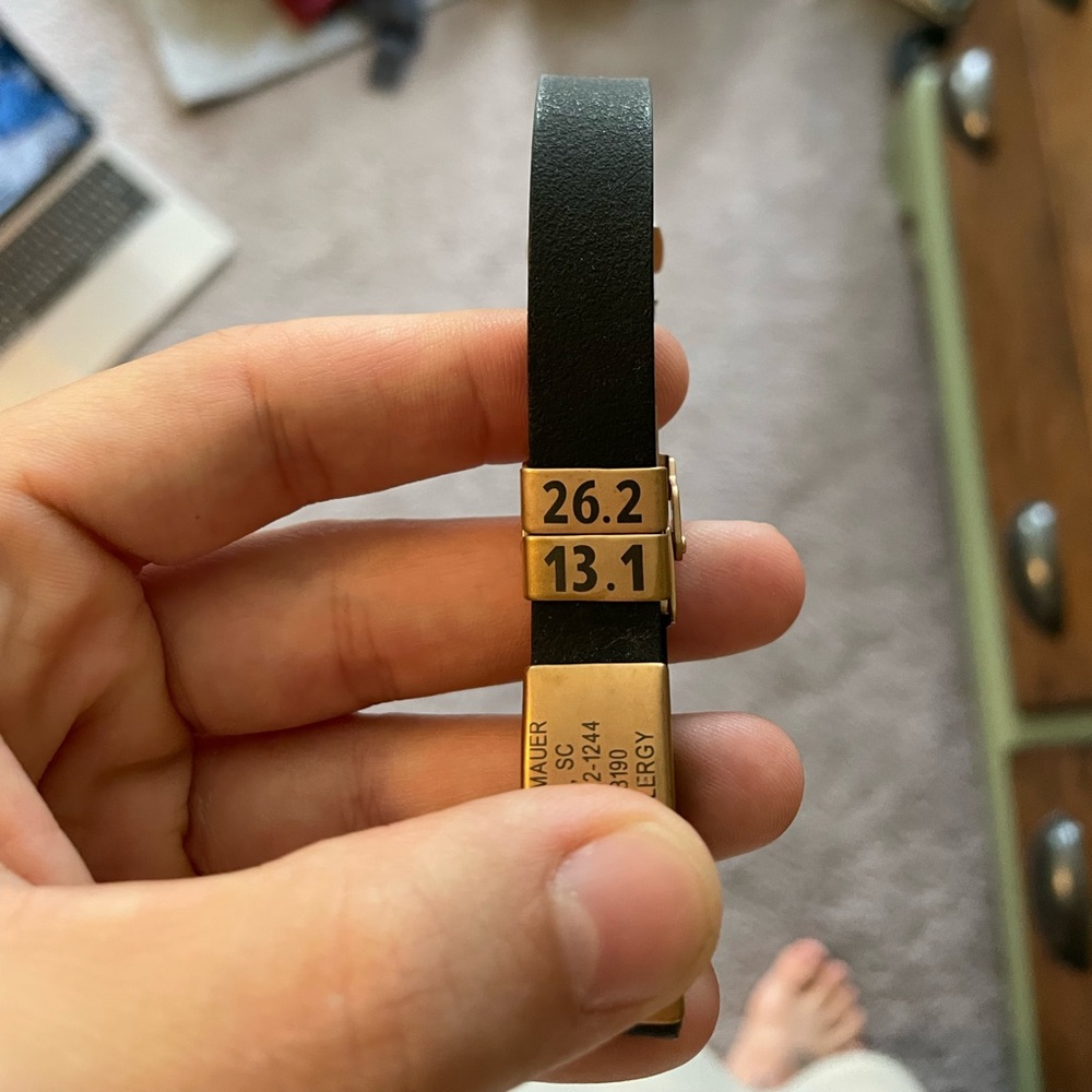 Runners id bracelet, including charms. Rose gold metal
